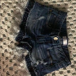 I’m selling denim shorts with cute flowers